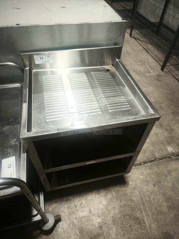 Underbar glass rack storage cabinet with drainboard top, stainless steel, two open shelves, visible label indicating item 74.