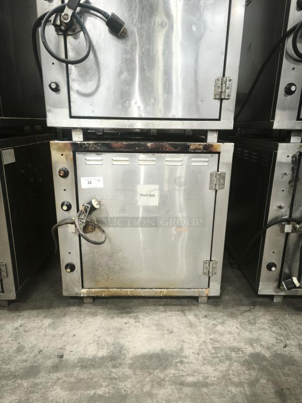 ROK RCI-P650E high-temperature lab stone oven, stainless steel, heavy-duty, visible wear, model/serial tags attached.