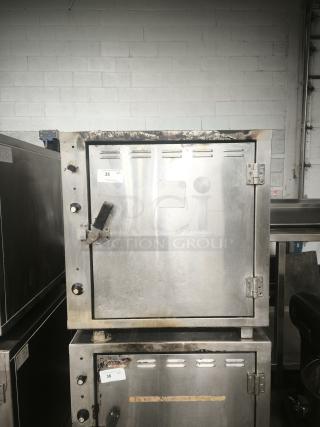 ROK RCI-P650E high-temperature lab stone oven, stainless steel, used condition with signs of wear, heats to 450 degrees.