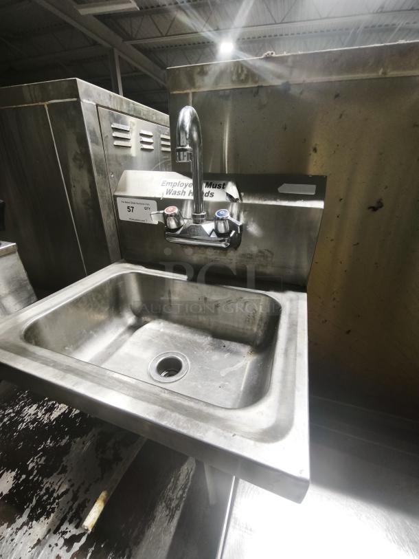 Single stainless steel sink with faucet, industrial style, visible wear, includes hot/cold controls. Tag indicates commercial use.
