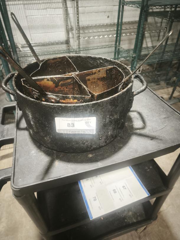 Soro Essentials 20 qt. aluminum pasta cooker with 4 rusted stainless steel inserts, used condition, auction tag visible.