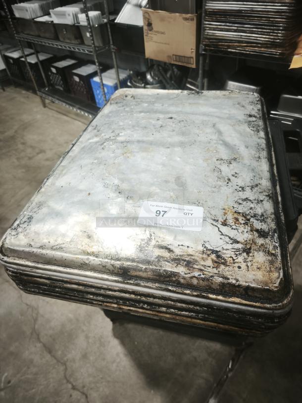 Aluminum cake baking pan, stackable, used condition with visible wear and discoloration. Auction label with number 97.