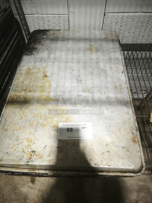 Aluminum cake baking pan with visible wear and surface discoloration, auction tag reading "98 x 6 QTY."
