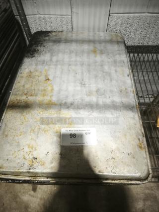 Aluminum cake baking pan with visible wear and surface discoloration, auction tag reading "98 x 6 QTY."