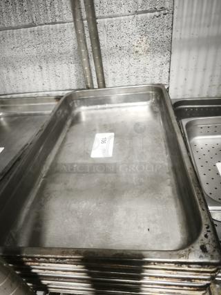 Full-size rectangular food pan, stainless steel, visible signs of use, stackable, marked with item tag "106".