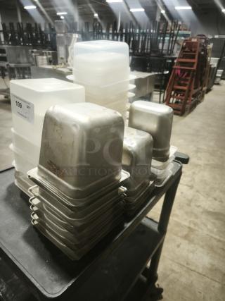 Stacked food containers in various sizes on a cart, including metal and plastic types. Visible label shows "109" with unspecified condition.