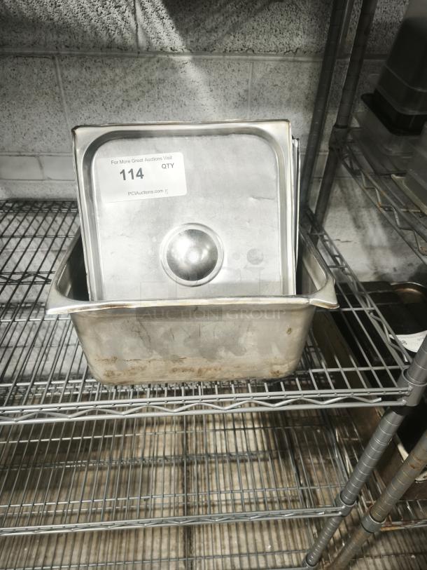 Stainless steel steam table pan with slotted lid, 1/2 full size. Visible auction label displays "114 QTY". Used condition.