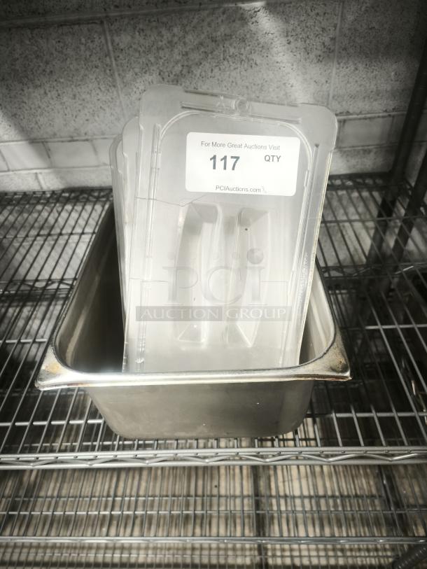 Stainless steel 1/3 full-size pan with slotted lid, slight rust on edge. Label reads "117 QTY" from PCI Auctions.