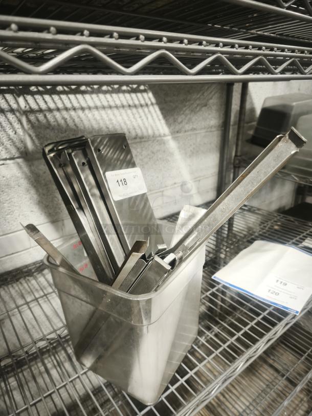 Stainless steel hot and cold table pan dividers in metal container; auction tag number 118 visible.