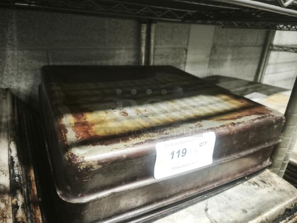 Stainless steel cooking pan 16"; shows signs of wear with rust patches; auction tag reads "119."