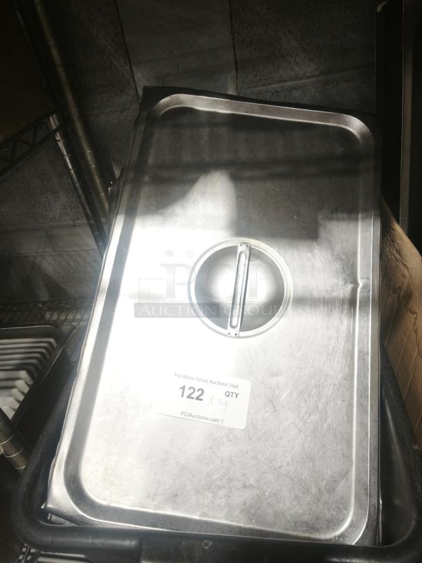 Stainless steel cover lid for full-size pan, silver, with center handle. Auction label "122" visible. Lightly used condition.