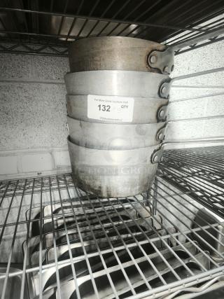 Stack of five heavy gauge sauce pans with visible wear, riveted handles, and a label indicating "132 x 5 QTY".