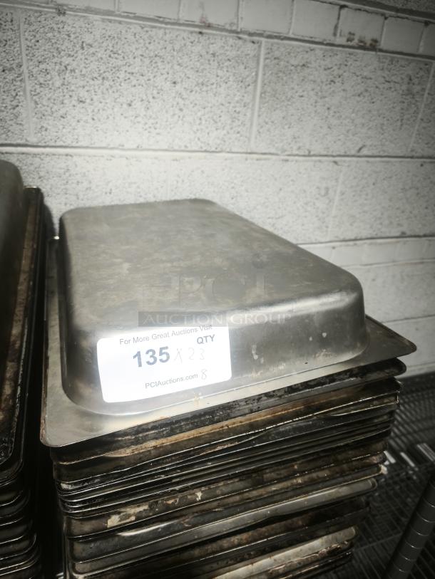 Full size 4" deep stainless steel food pan, used condition, stack of pans, auction label "135 x 23 QTY".
