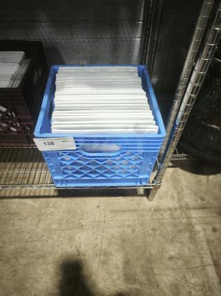 10" bright white square porcelain plates in blue crate on metal shelf, tag indicates quantity. Plates appear in good condition.