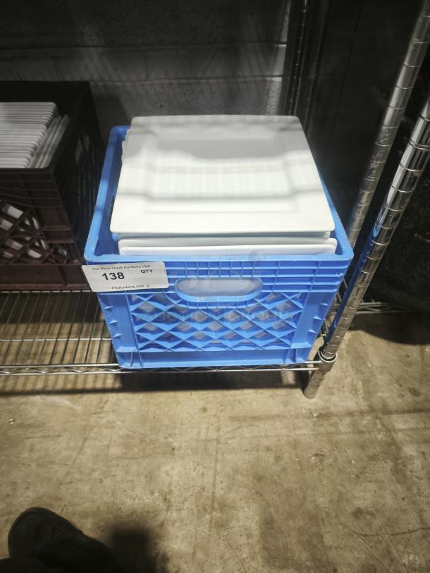 10" bright white square porcelain plate in a blue crate, mint condition, stacked with similar plates, labeled quantity 138.