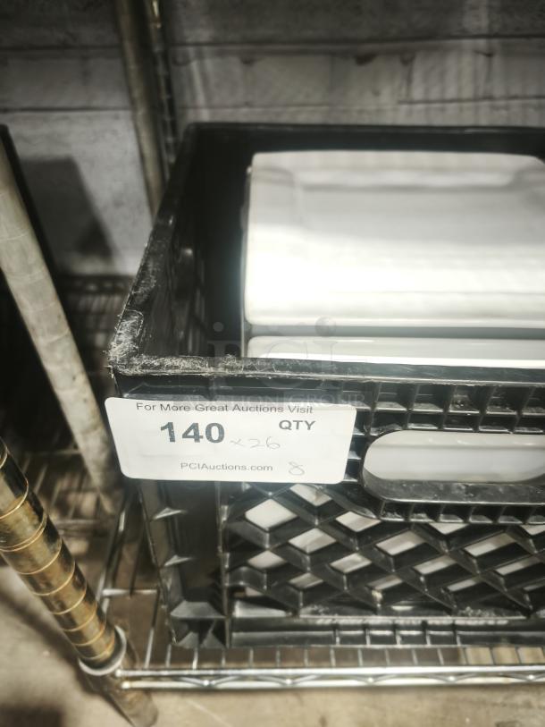 9" bright white square porcelain plates in a plastic crate, quantity 26. Plates appear new, with no visible markings or damage.