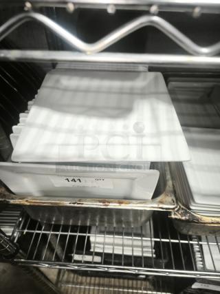 9" bright white square porcelain plate, excellent condition, marked "141 QTY" from PCI Auctions.