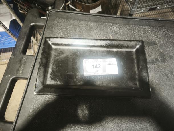 Matte black rectangular stoneware platter, gently used, with label indicating item number 142. Simple, elegant design.