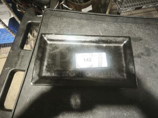 Matte black rectangular stoneware platter, gently used, with label indicating item number 142. Simple, elegant design.