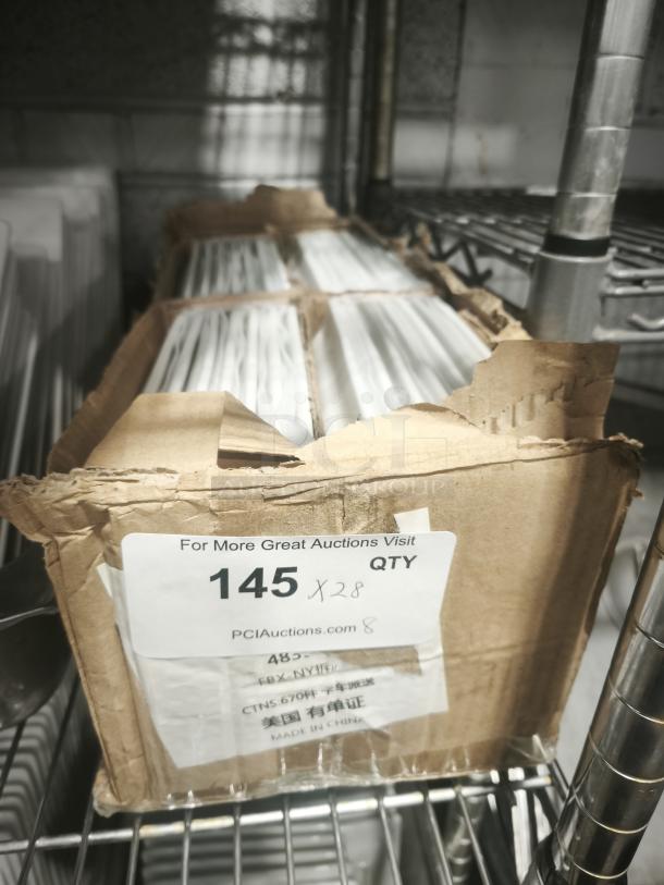 Box of white square porcelain plates in storage, labeled with quantity 145x28. Items in original packaging, made in China.