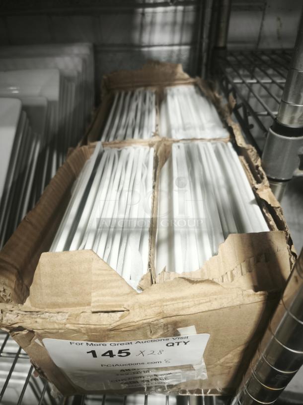 Rectangular bright white square porcelain plates, bulk quantity in a cardboard box, labeled "145 X 28 QTY," on wire shelf.