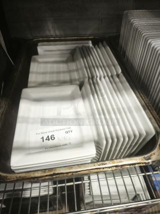 Rectangular bright white square porcelain plates stacked, excellent condition, quantity 40, auction label visible.