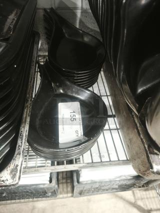 Black ceramic serving dish set, glossy finish, stacked on a metal shelf. Visible tag indicates quantity: 14.