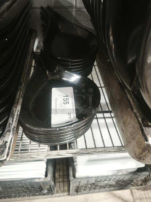 Black ceramic serving dish set in excellent condition with a glossy finish, stacked on a shelf. Quantity tag visible.