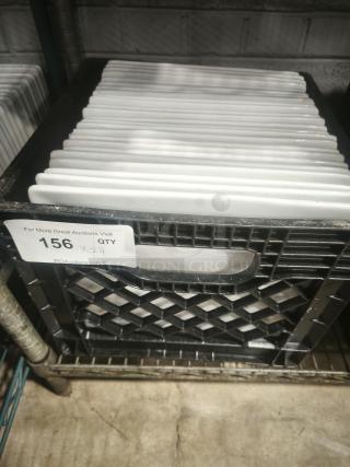 10" bright white square porcelain plates in crate, quantity of 24, displayed on shelf. Auction label visible with lot number 156.