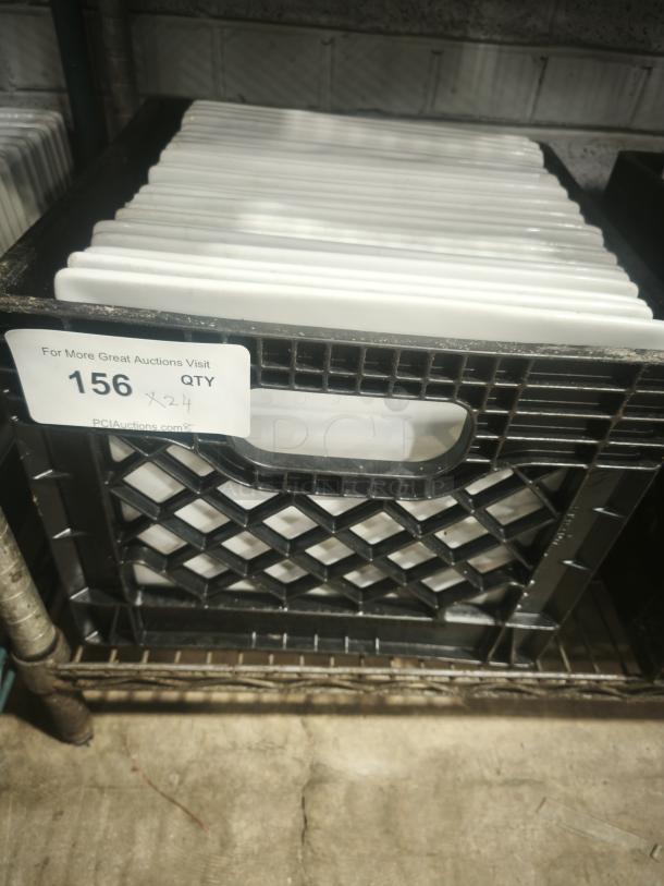 10" bright white square porcelain plates, stacked in crate. Excellent condition, tag indicates quantity of 24.