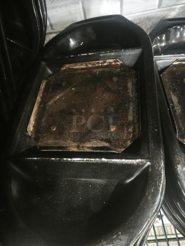 Hot stone serving platter from Black Rock Bar and Grill. Features a heated black stone slab, moderate wear visible.