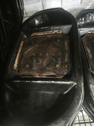 Hot stone serving platter from Black Rock Bar and Grill. Features a heated black stone slab, moderate wear visible.