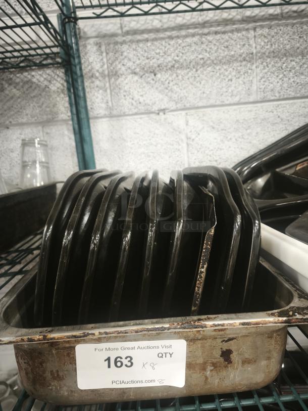 Black Rock Bar and Grill hot stone serving platters in tray, quantity 8. Used condition with visible wear. Auction label "163."