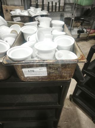 White porcelain pot pie dishes in bulk, medium size, Aluma brand, shown in a rustic bin, includes auction label indicating 170 units.