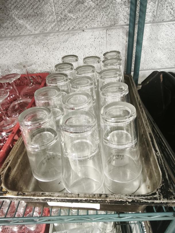 Vintage restaurant glass tumblers, clear, cylindrical shape, good condition, displayed upside down on a metal tray.