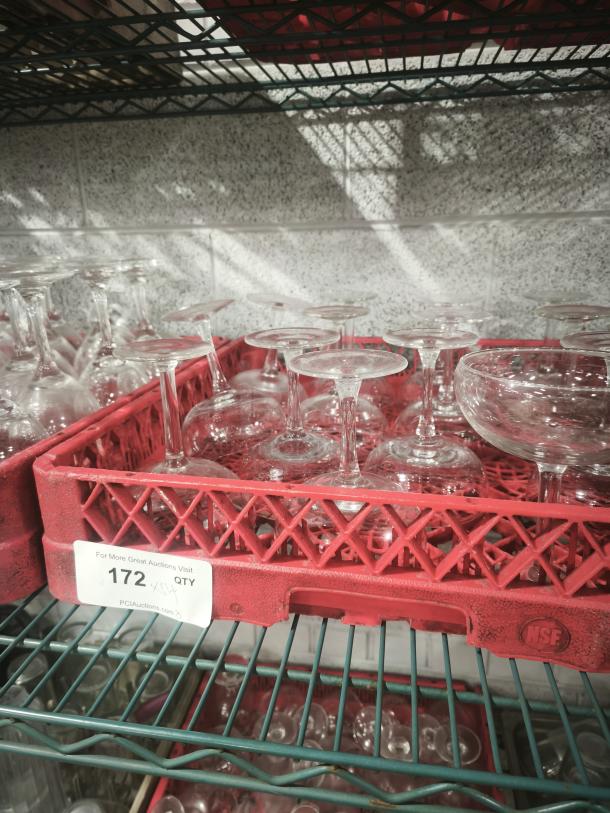 Vintage footed glass low sherbet bowls in a red container. Clear glass, set of multiple pieces, used condition. Label "172 QTY."