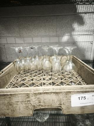 Fluted champagne glasses with clear swirl design, set of 12, in good condition, displayed in a rustic crate.