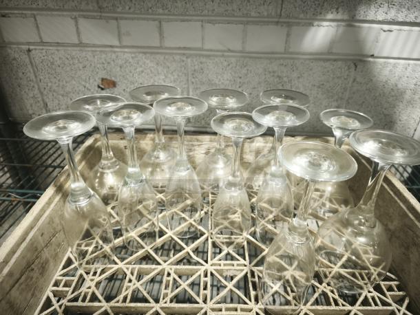 Fluted Champagne Clear Swirl Optical glasses lot, featuring intricate swirling design, in excellent condition, displayed upside-down in a wooden crate.