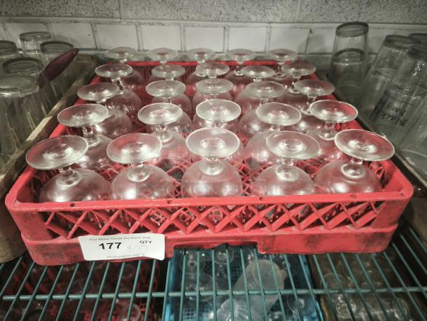 Vintage footed glass sherbet bowls in a red crate, good condition, displayed upside down. Tag shows lot number 177.