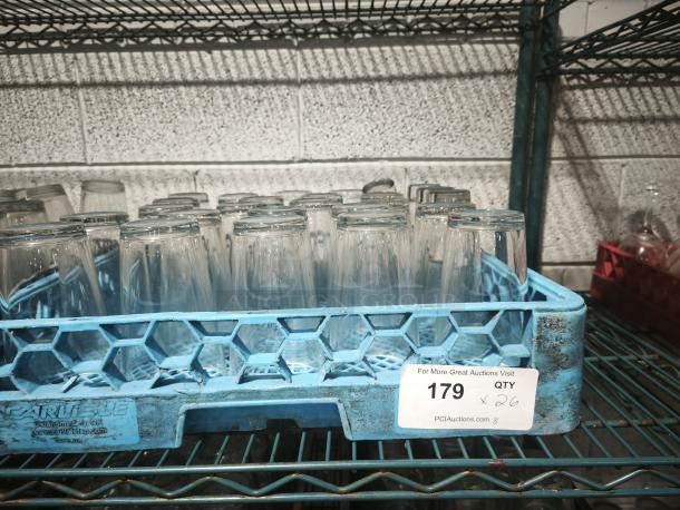 Vintage glass tumblers in a blue crate, set of 26, used condition. Auction lot number 179 visible on the label.