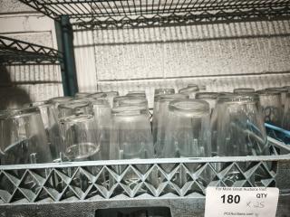 Vintage restaurant glass tumblers in a crate, set of 25. Clear glass, gently used condition. Tags indicate quantity.