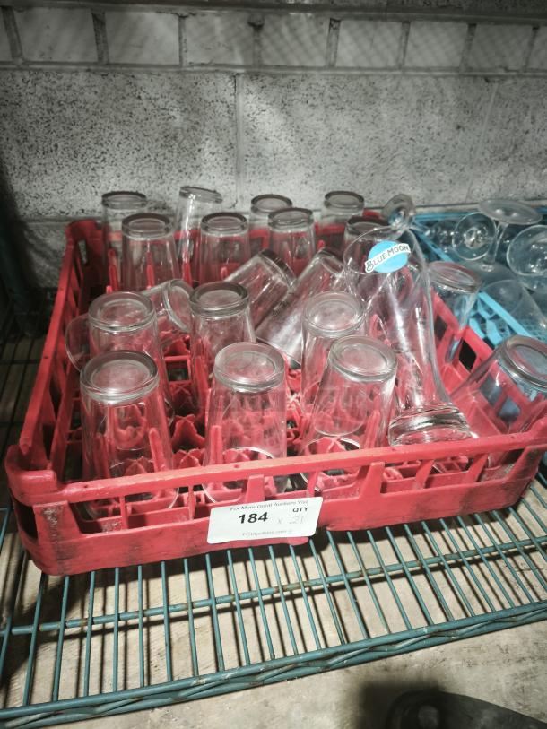 Vintage restaurant glass tumblers in a red rack, labeled "184 x 21." Marked with a "Blue Moon" sticker.