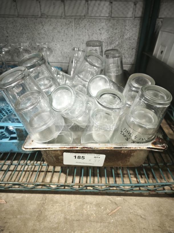 Vintage restaurant glass tumblers in metal tray, quantity 37, good condition, ideal for collectors or decor.