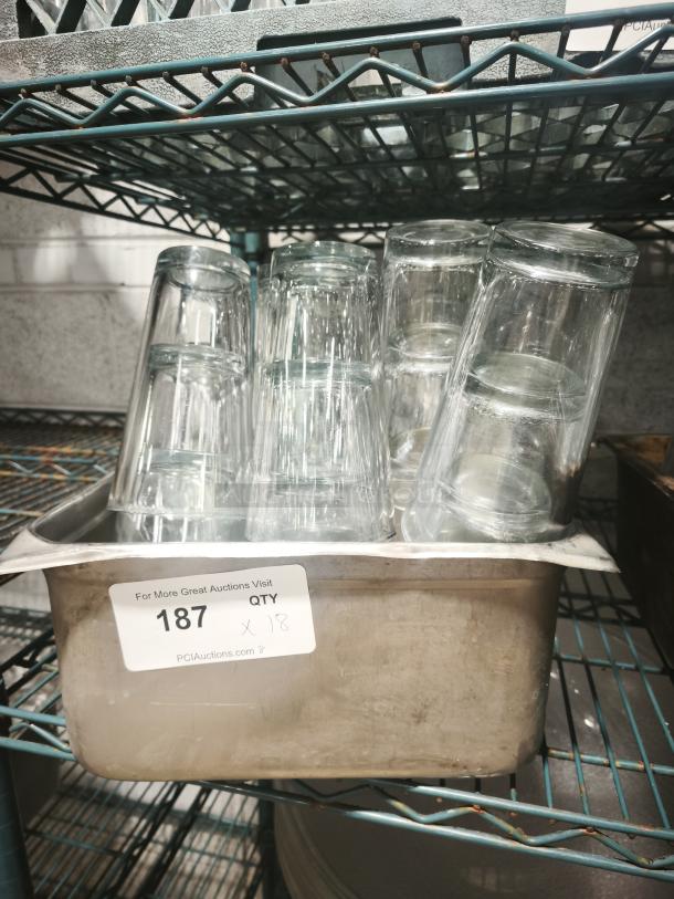 Vintage glass tumblers in a metal container, set of 18. Clear glass with slight wear, auction label visible with lot number 187.
