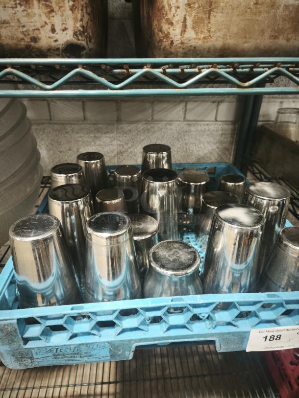 Vintage stainless steel cocktail shaker mixer, polished finish, good condition, stored in a blue rack. Auction tag visible.