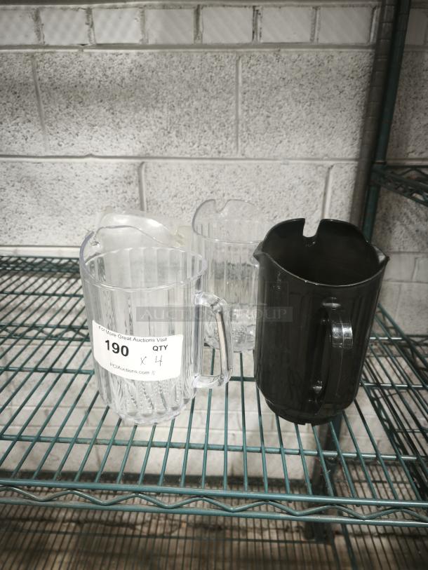 Three plastic pitchers on a metal shelf, two clear and one black. Label indicates quantity of 4.