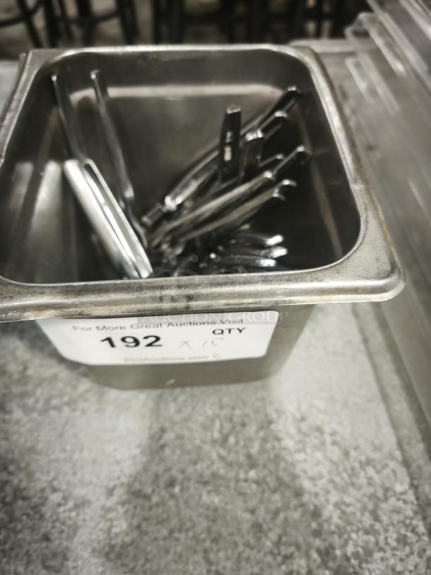 Stainless steel crab crackers and tools in a metal container, labeled "QTY 192," ideal for seafood preparation.