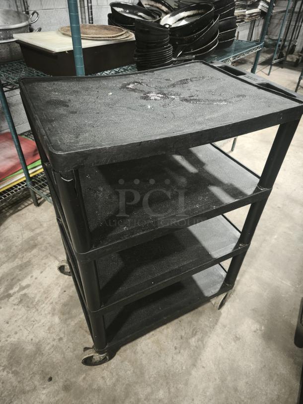 Offex Endura black presentation cart, 4 shelves, 35 1/4" H, used condition, wear visible on surfaces, wheeled base.