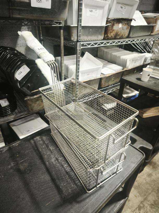 Brand new commercial wired mesh fry basket with front hook and black non-slip grip handle, perfect condition.