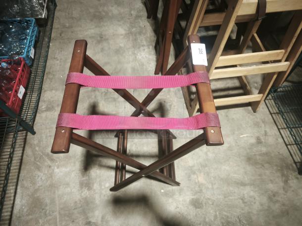 Wooden tray stand, folding, 32-1/4" high, mahogany, with red straps, auction tag number 205 visible, in excellent condition.